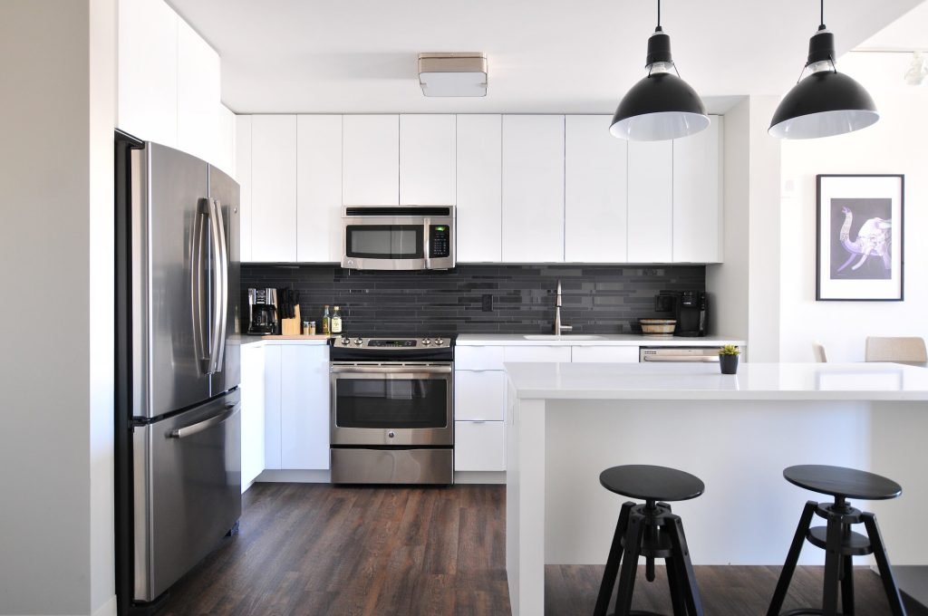Bright white remodeled kitchen with black fixtures